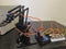 Controlling 4DOF Robotic Arm Claw Kit with 16 channel PWM/Servo Shield using analog input.